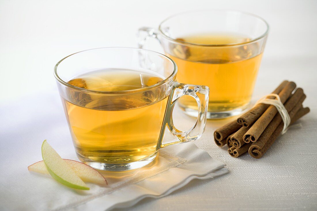 Two Glasses of Apple Cider; Bundle of Cinnamon Sticks