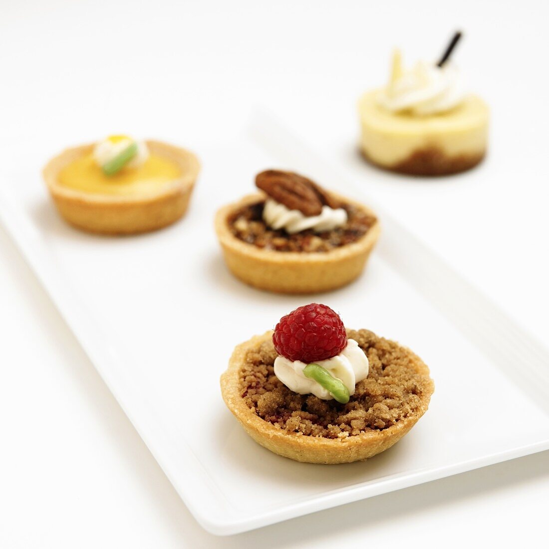 Four Assorted Mini Tarts; Raspberry Crumb