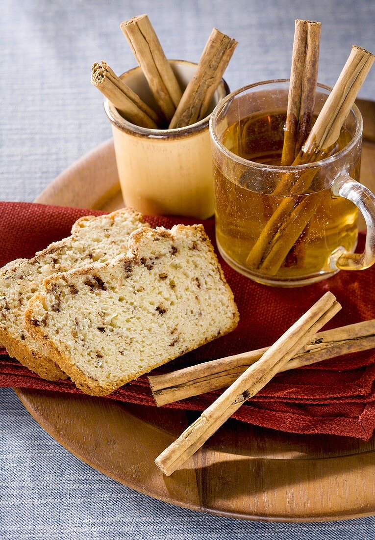 Two Slices of Cinnamon Loaf Cake, Mug of Cider, Cinnamon Sticks