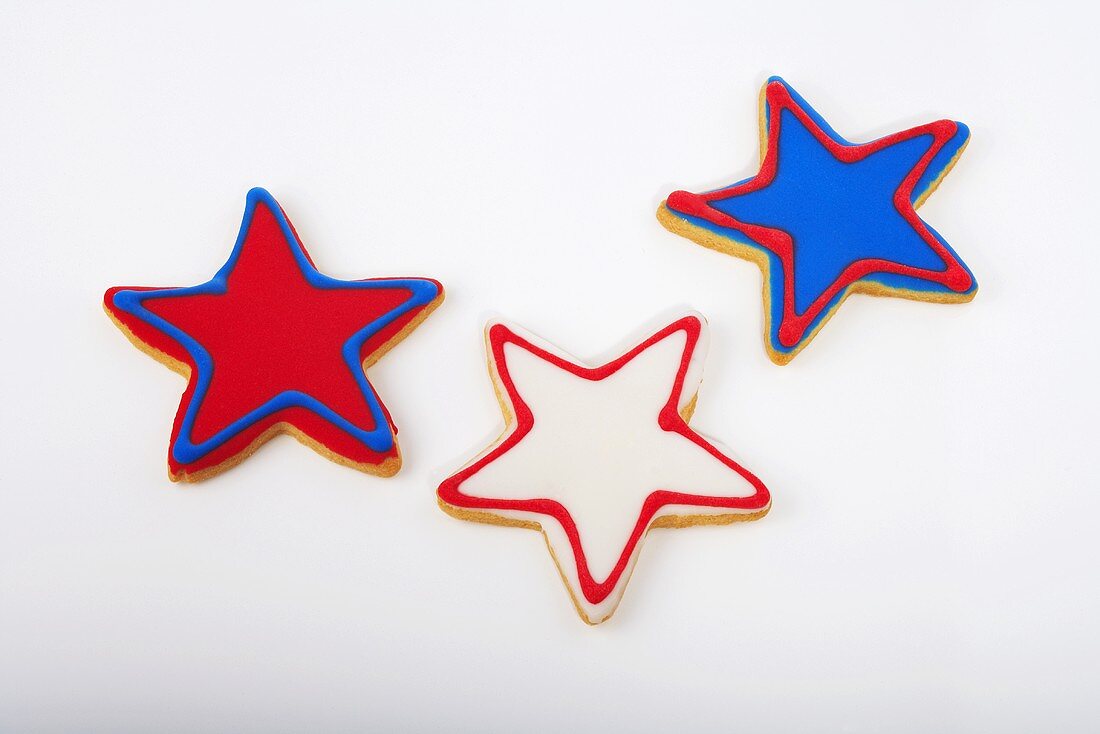 Three Red White and Blue Star Cookies on a White Background