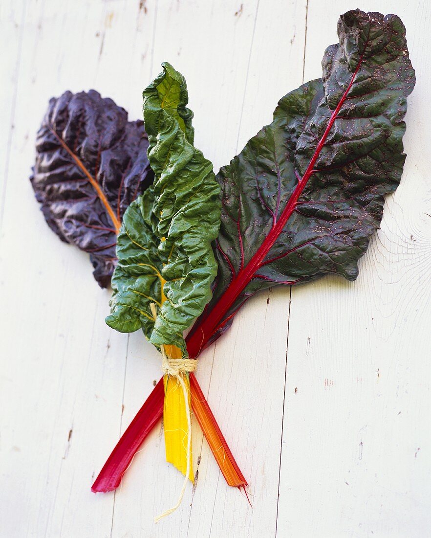 Three Stalks of Swiss Chard on a Table