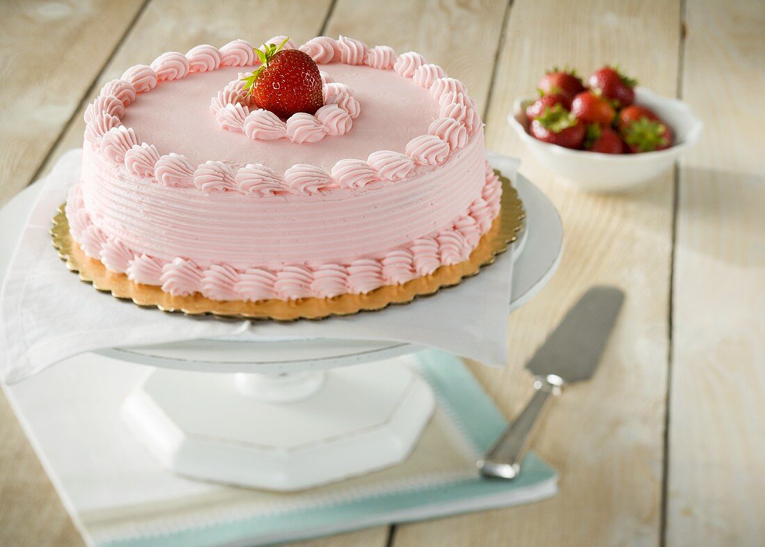 Whole Cake with Strawberry Frosting, Topped with a Strawberry