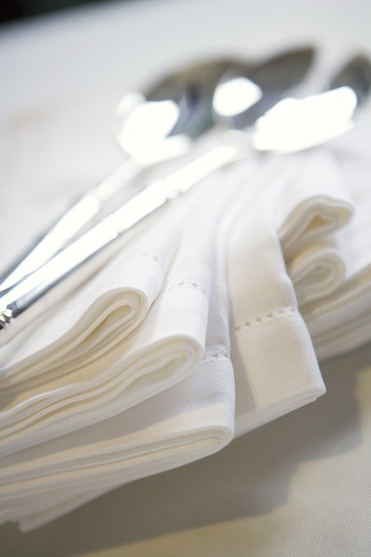 Stack of Cloth Napkins with Spoons