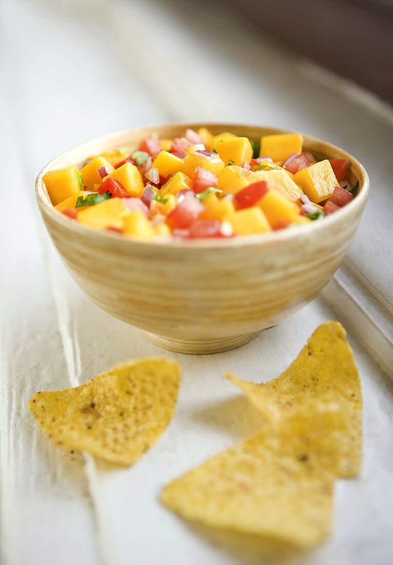 Bowl of Tomato Mango Salsa with Chips