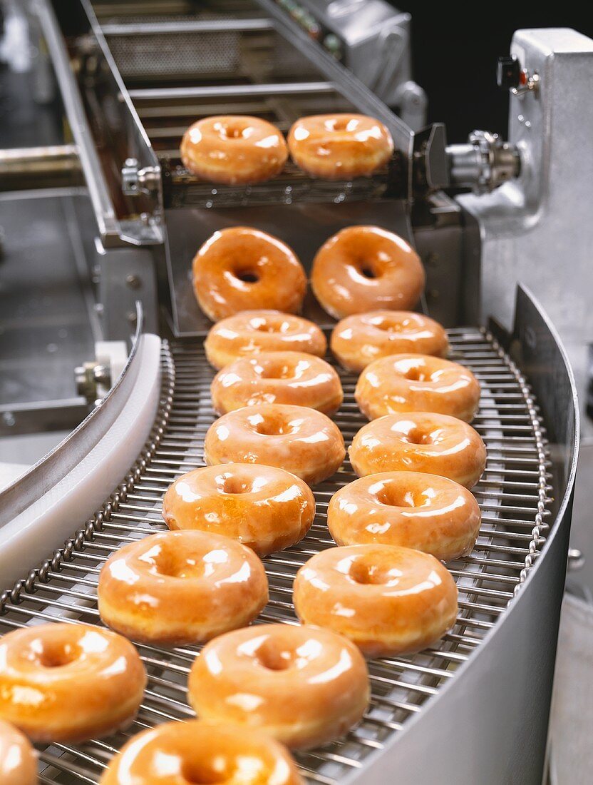 Glazed Donuts on Conveyor Belt
