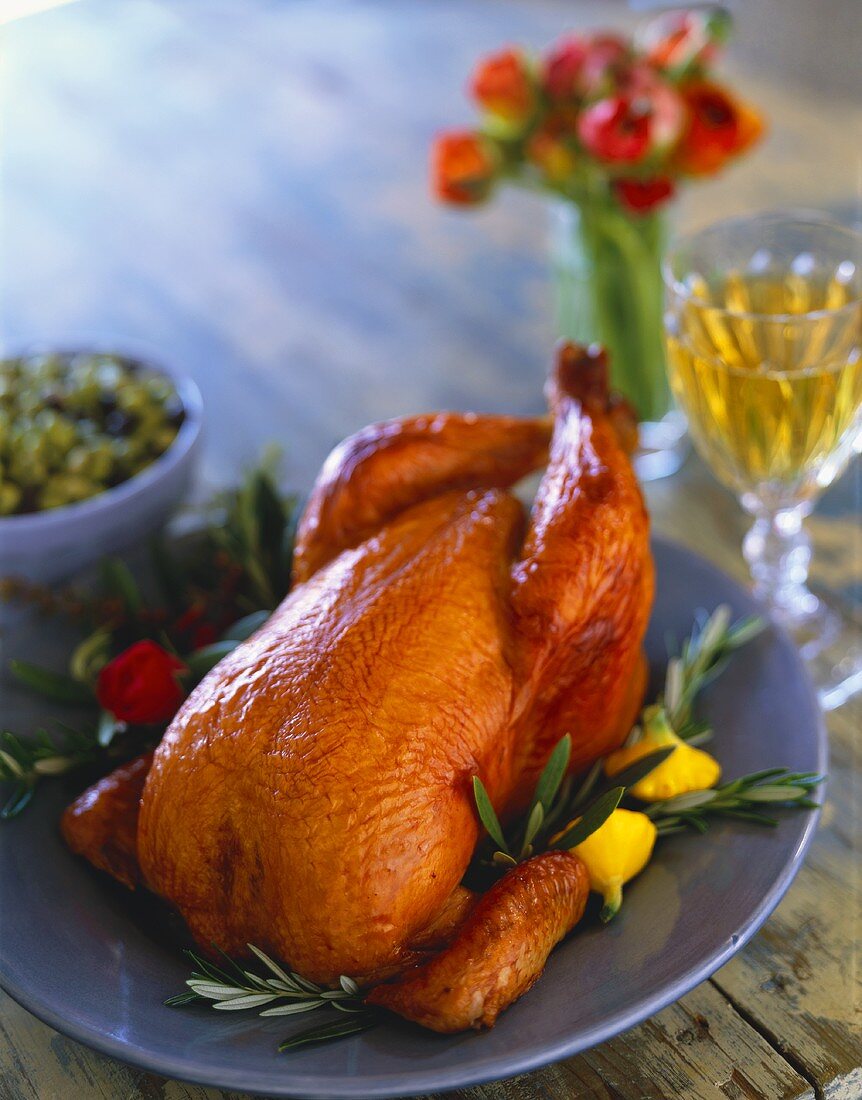 Whole Roast Chicken on Blue Plate