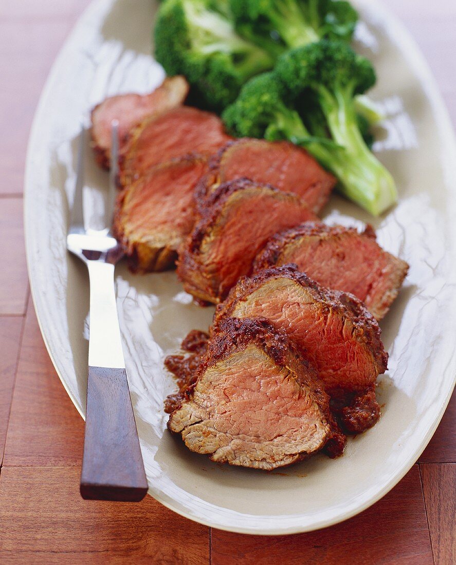 Sliced Beef Loin on a Platter with Broccoli