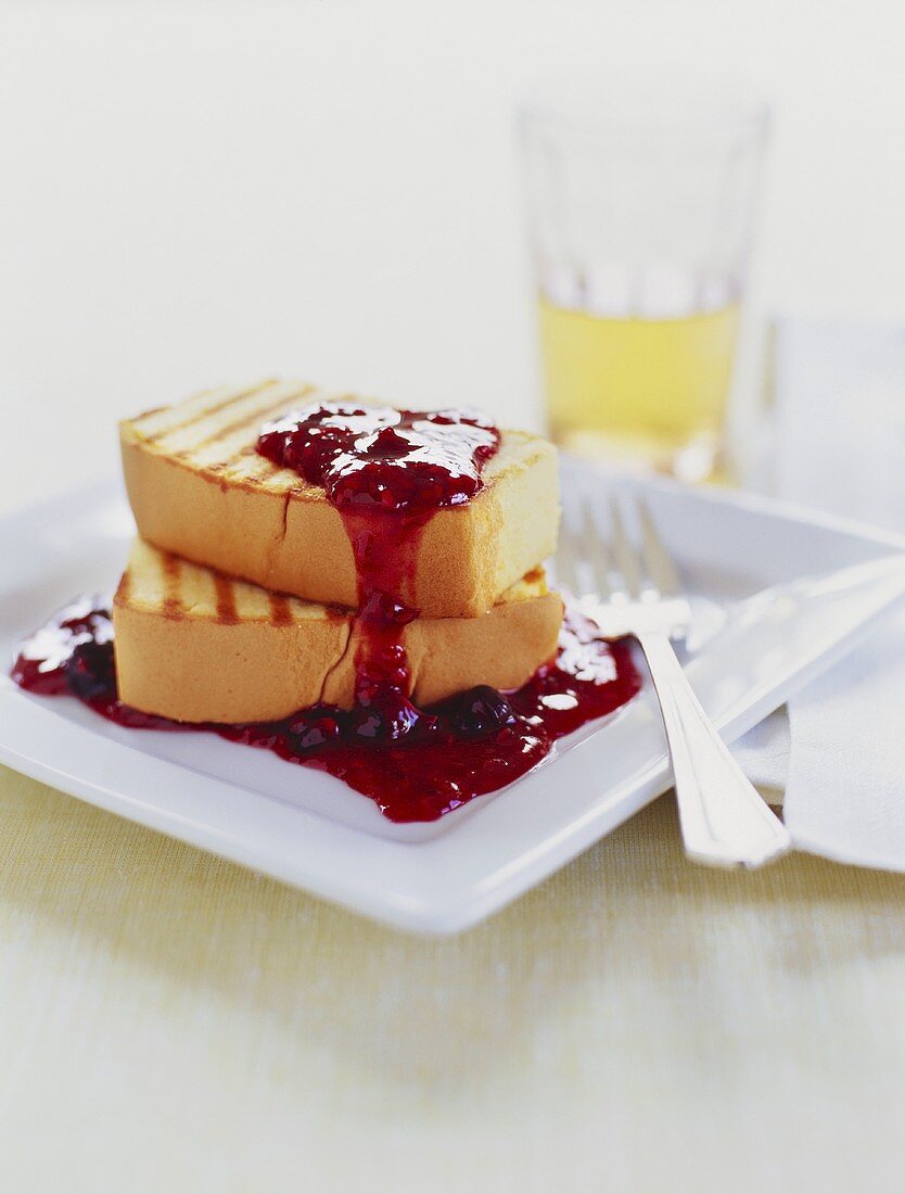 Two Slices of Grilled Pound Cake with Berry Sauce
