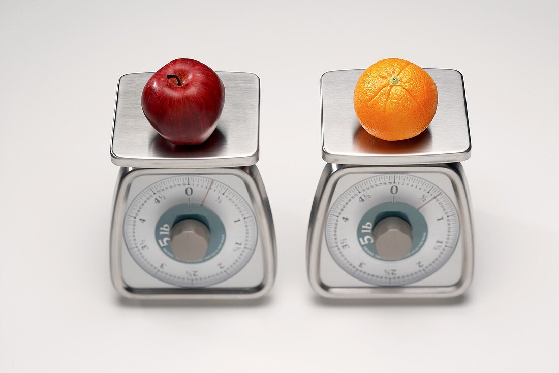 Two Scales; One with an Apple and One with an Orange