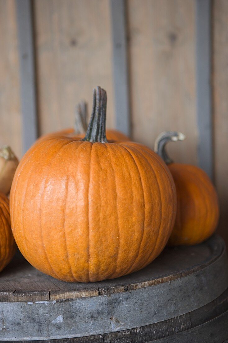 Pumpkins on a Wooden Barrel