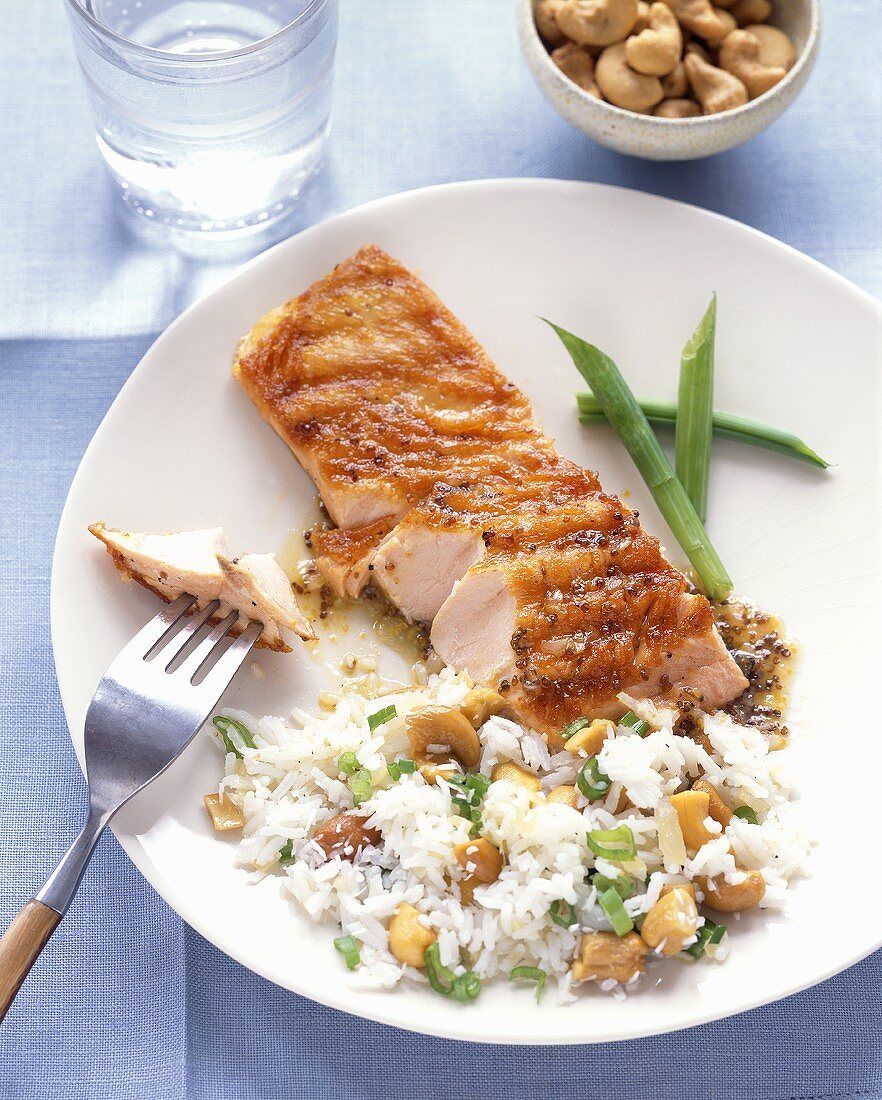 Salmon with Piece on Fork and Cashew Rice