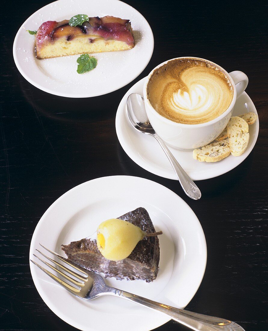 Slice of Chocolate Cake with Pear, Cappuccino and Slice of Fruit Cake