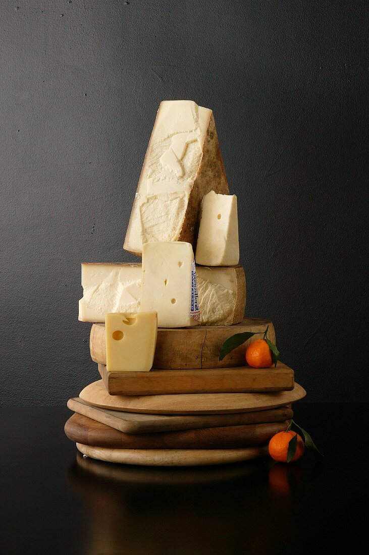 Various Cheese with Tangerines on Breadboards