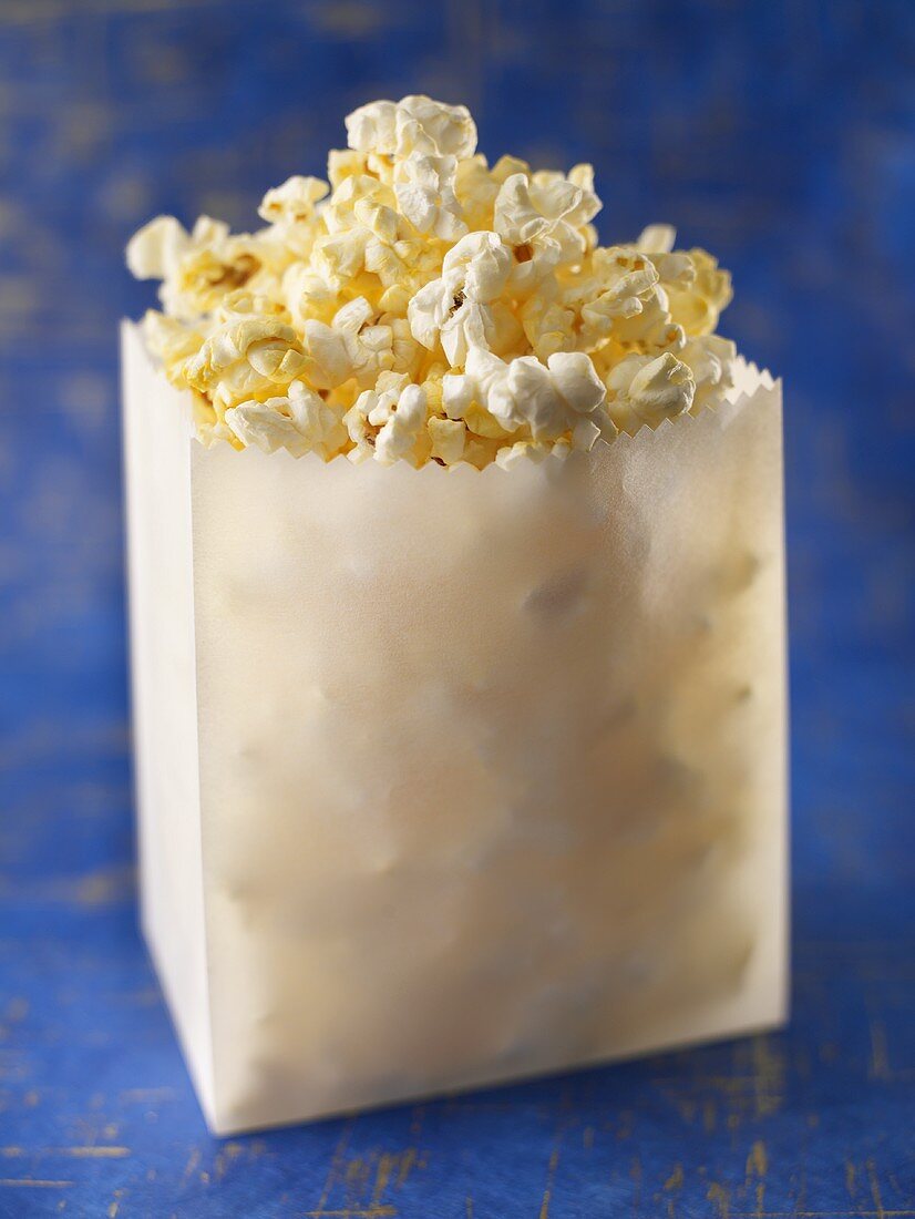 Bag of Popcorn on a Blue Background