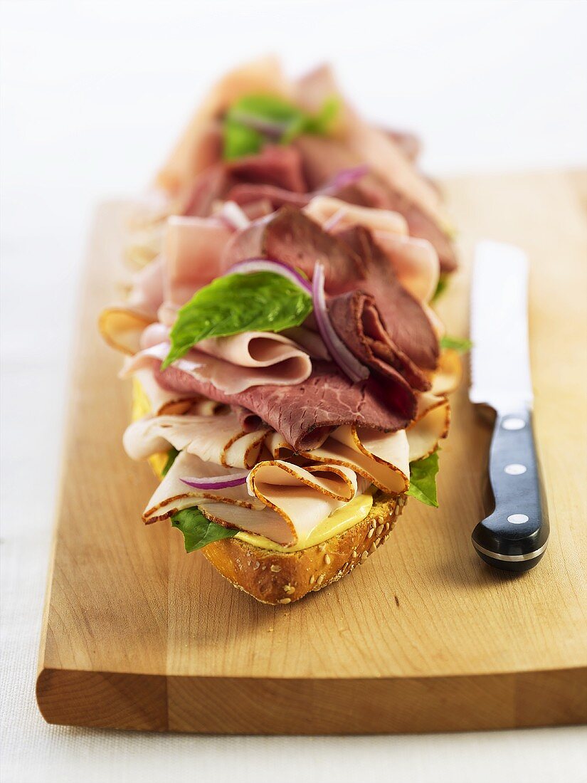 Open Meat Sandwich on a Cutting Board