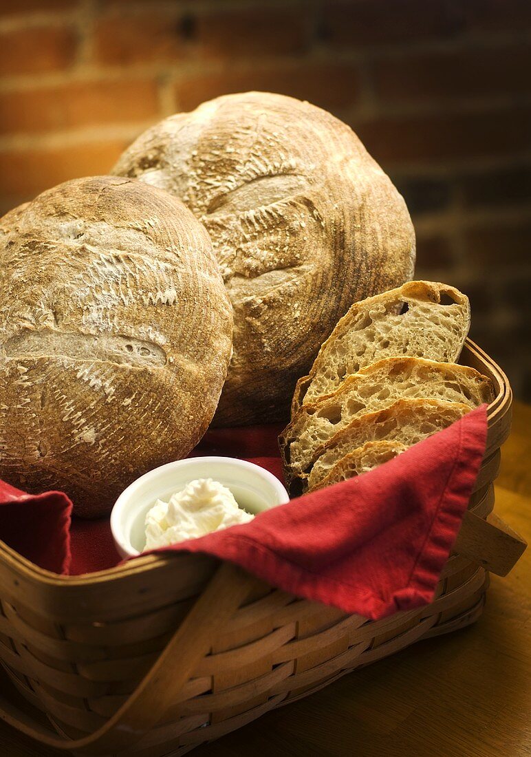 Loaves and Slices of Sourdough Bread in a Basket