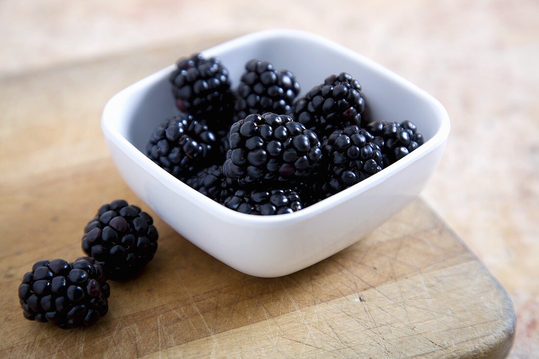 Blackberries in and Beside a Bowl