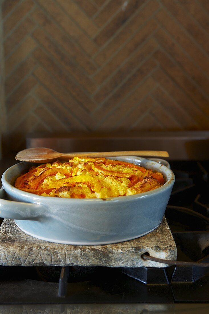 Bread Puffing in Baking Dish on Stove