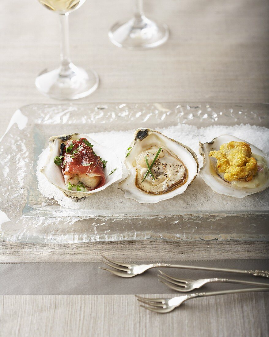 Three Types of Oysters on a Glass Plate
