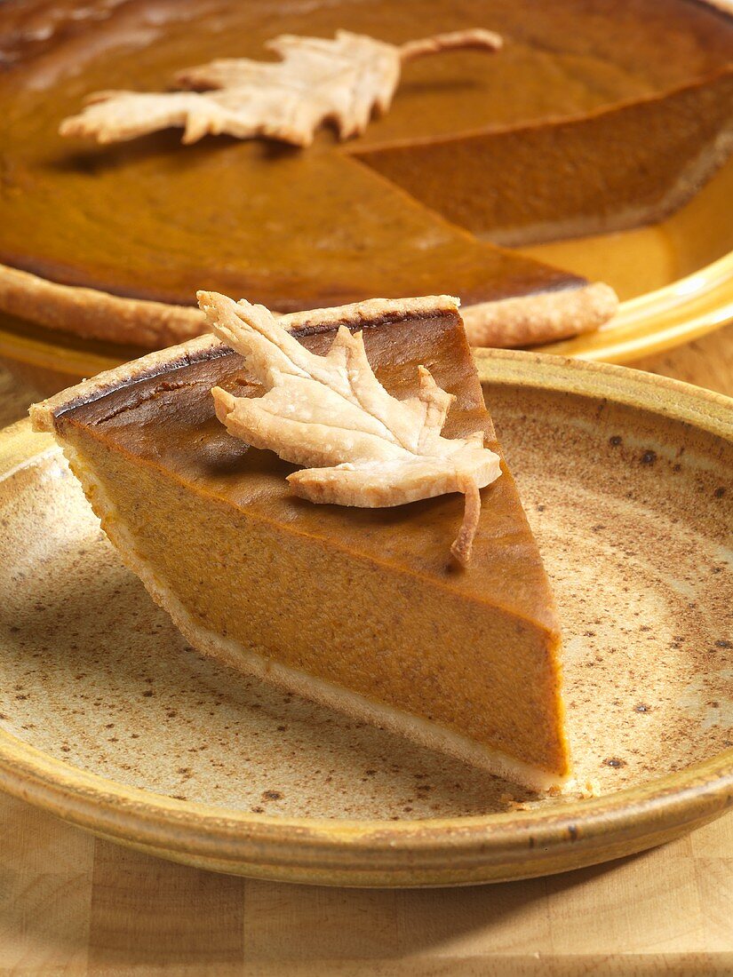 Slice of Pumpkin Pie with Pastry Leaf Garnish