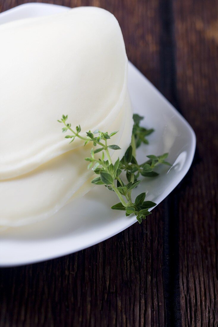 Freshly Sliced Provolone Cheese with Thyme Sprig