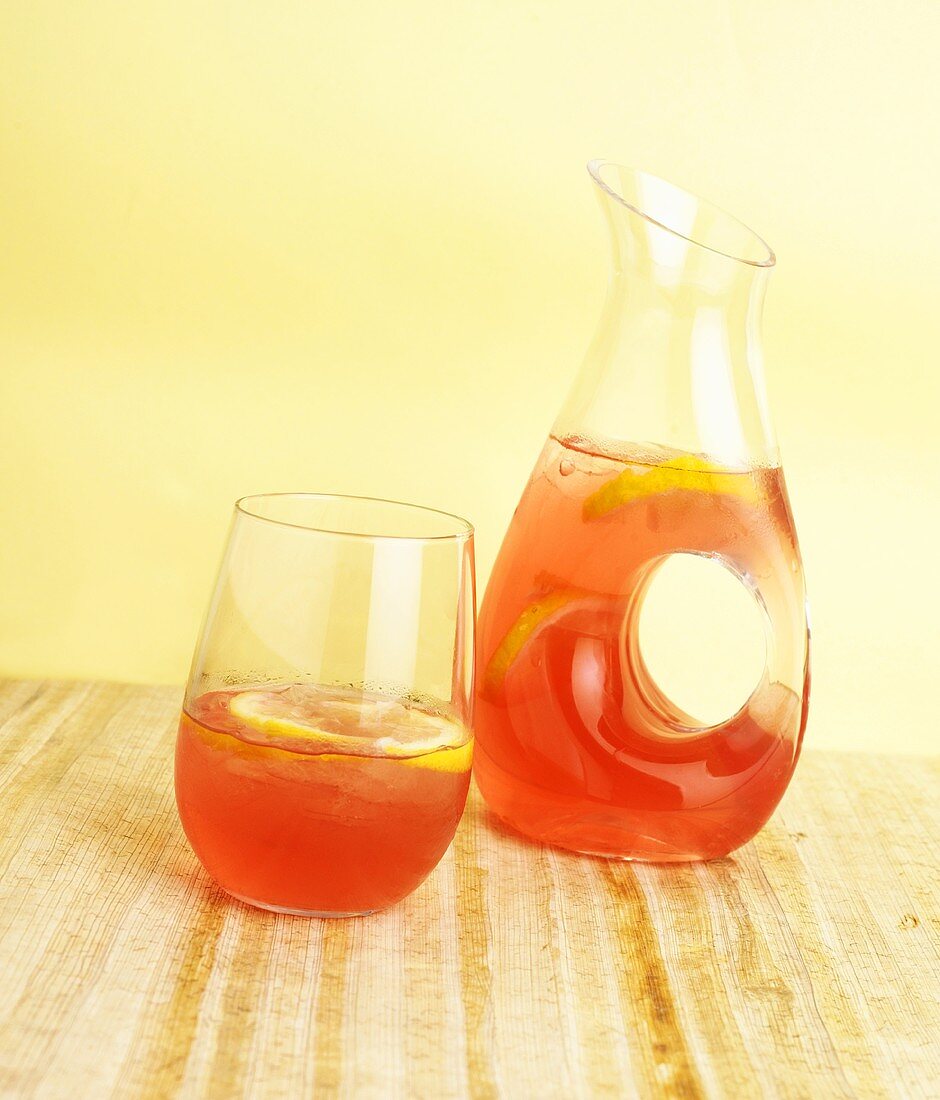 Glass and Pitcher of Cranberry Lemonade