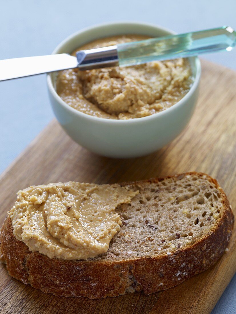 Homemade Peanut Butter on Bread and in Bowl