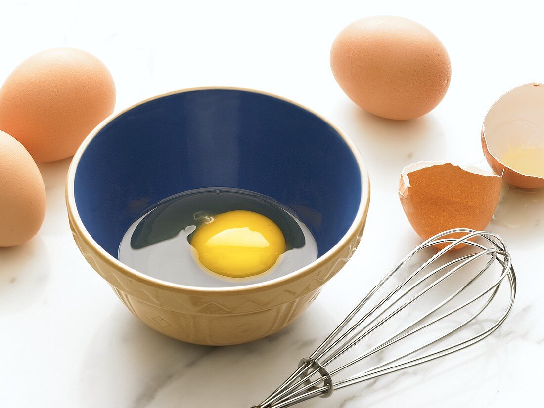 Cracked Egg in a Bowl; Whisk