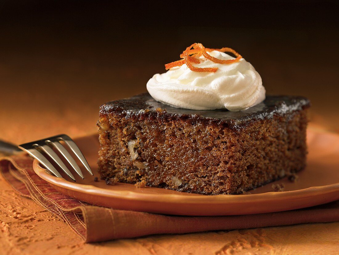 Piece of Prune Cake with Whipped Cream