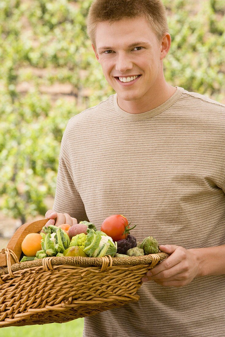 Man Holding a Basket of Organic Produce
