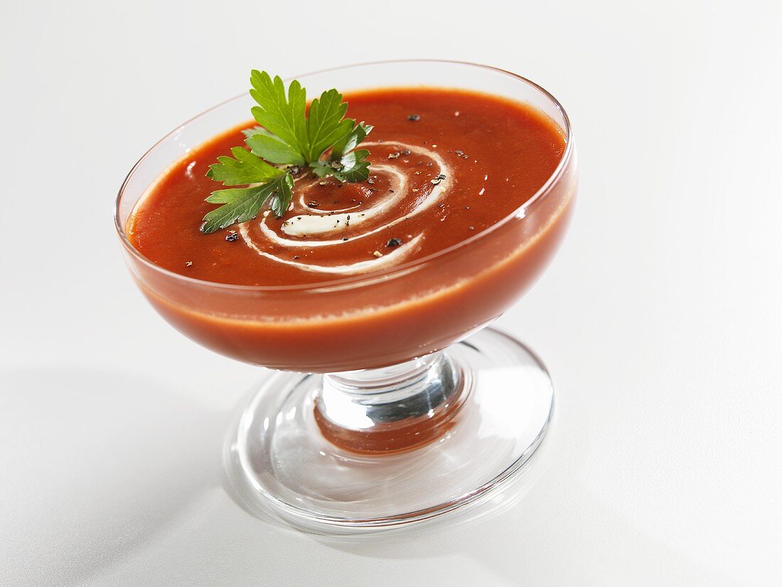 Roasted Tomato Soup with Cream Swirl and Parsley Garnish