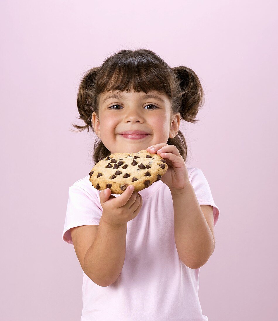 Little Girl Holding Chocolate Chip Cookie