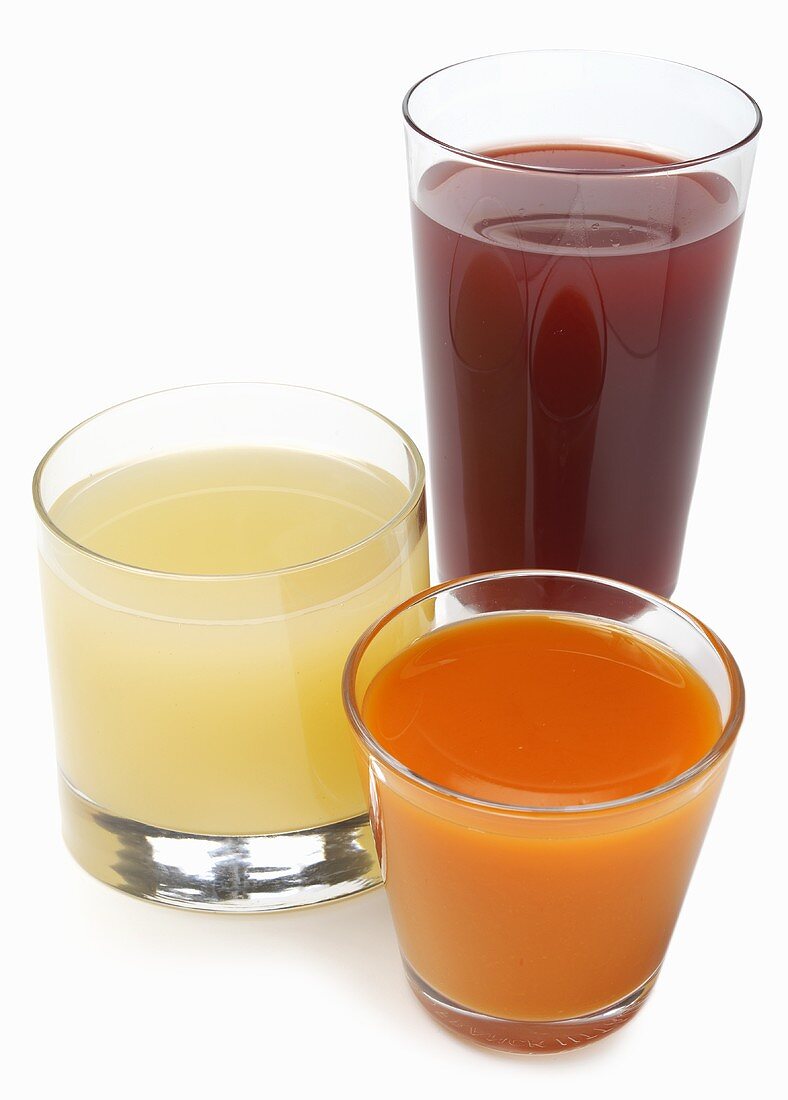 Three Glasses of Assorted Juice; White Background