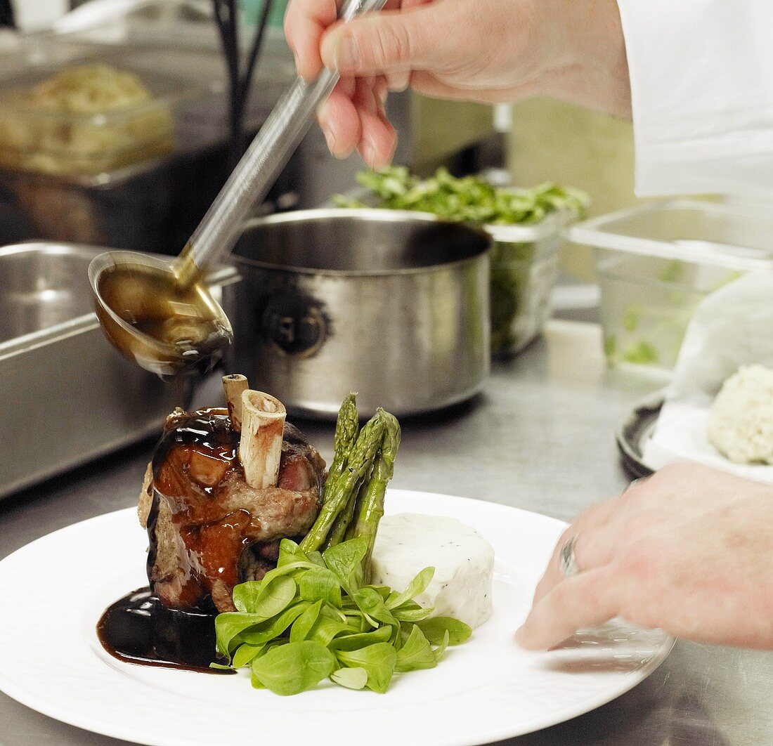 Chef Preparing Beef Shank with Asparagus