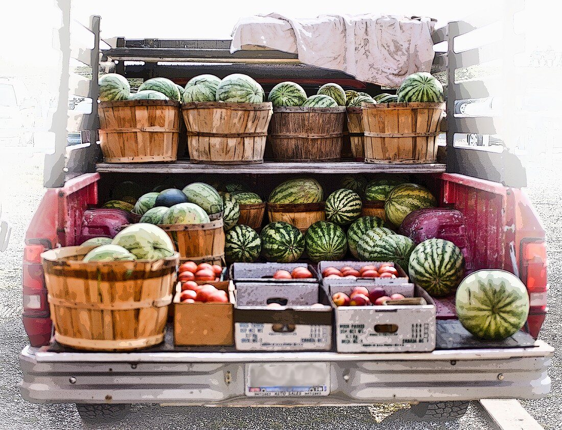 Baskets of Fresh Watermelons and Peaches in a Truck