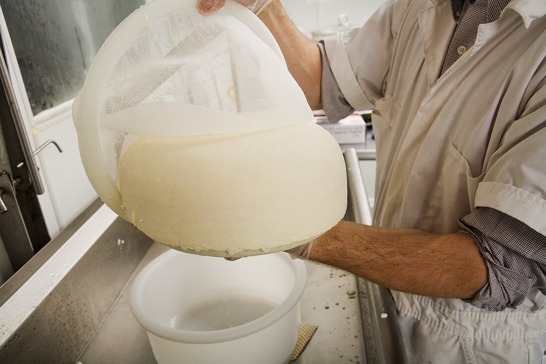 Man Holding Finished Cheese