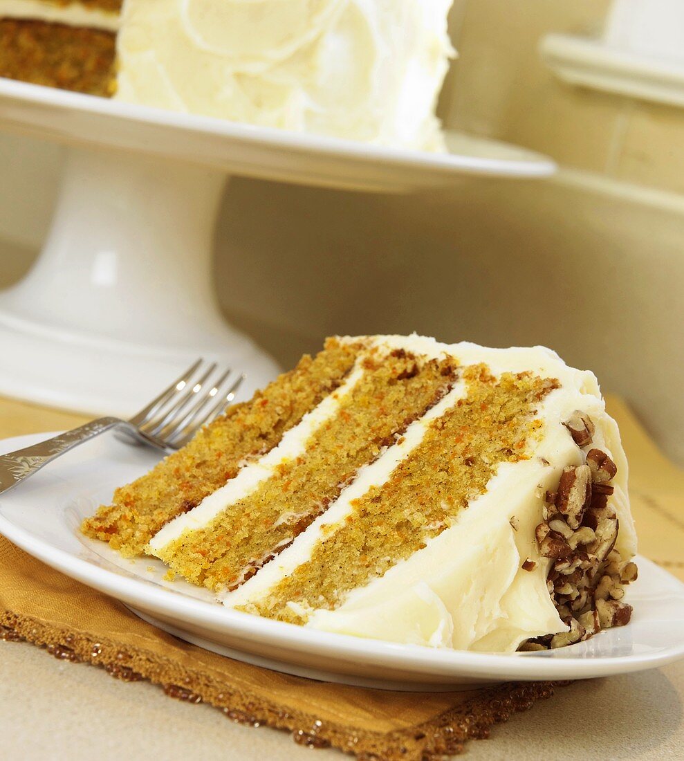 Slice of Layered Carrot Cake with Cream Cheese Frosting