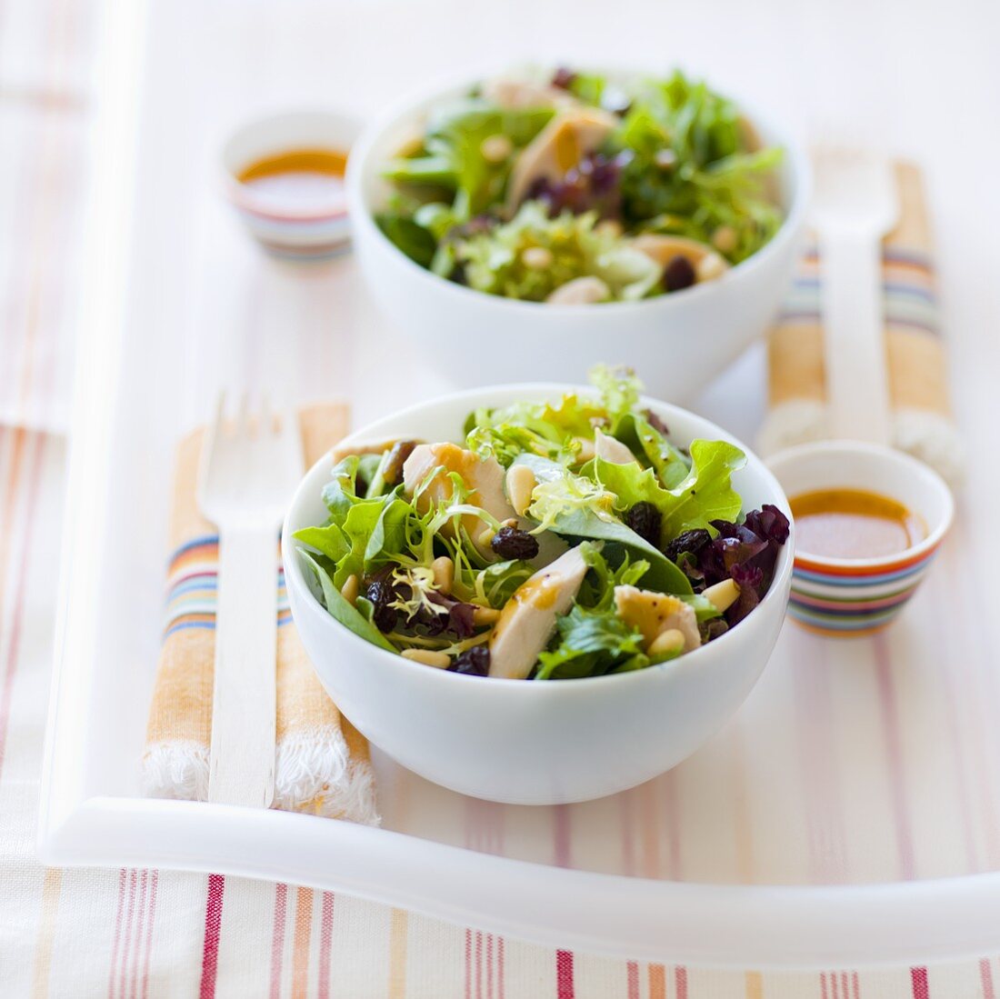 Two Bowls of Salad with Chicken and Pine Nuts, Dressing on the Side