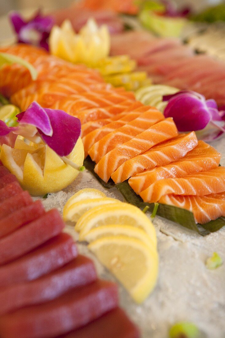 Tuna and Salmon Sashimi  with Lemon Wedges