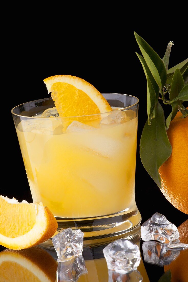 Screwdriver with Orange Wedges and Ice Cubes