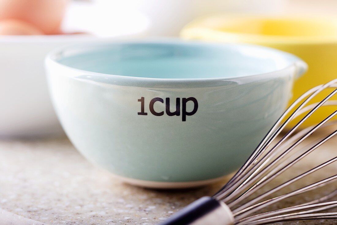 Water in One Cup Measuring Cup; Whisk