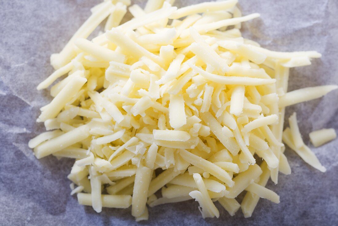 Small Pile of Shredded Mozzarella Cheese on Paper
