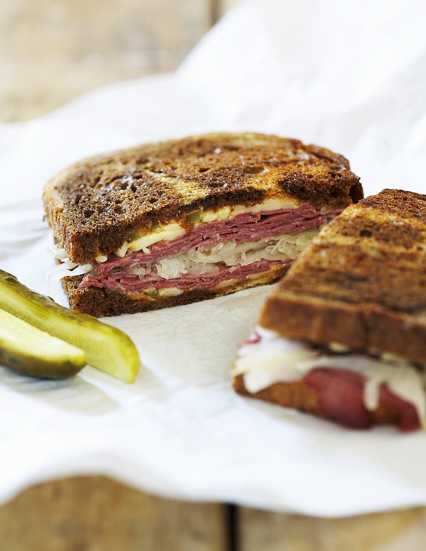 Reuben Sandwich with Pickle on Paper