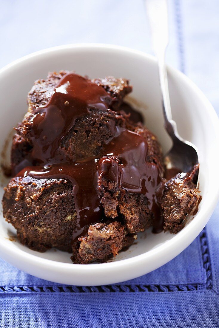 Bowl of Chocolate Bread Pudding with Chocolate Sauce