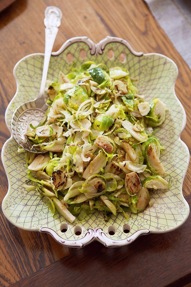 Sliced Brussels Sprouts on Serving Platter; Serving Spoon