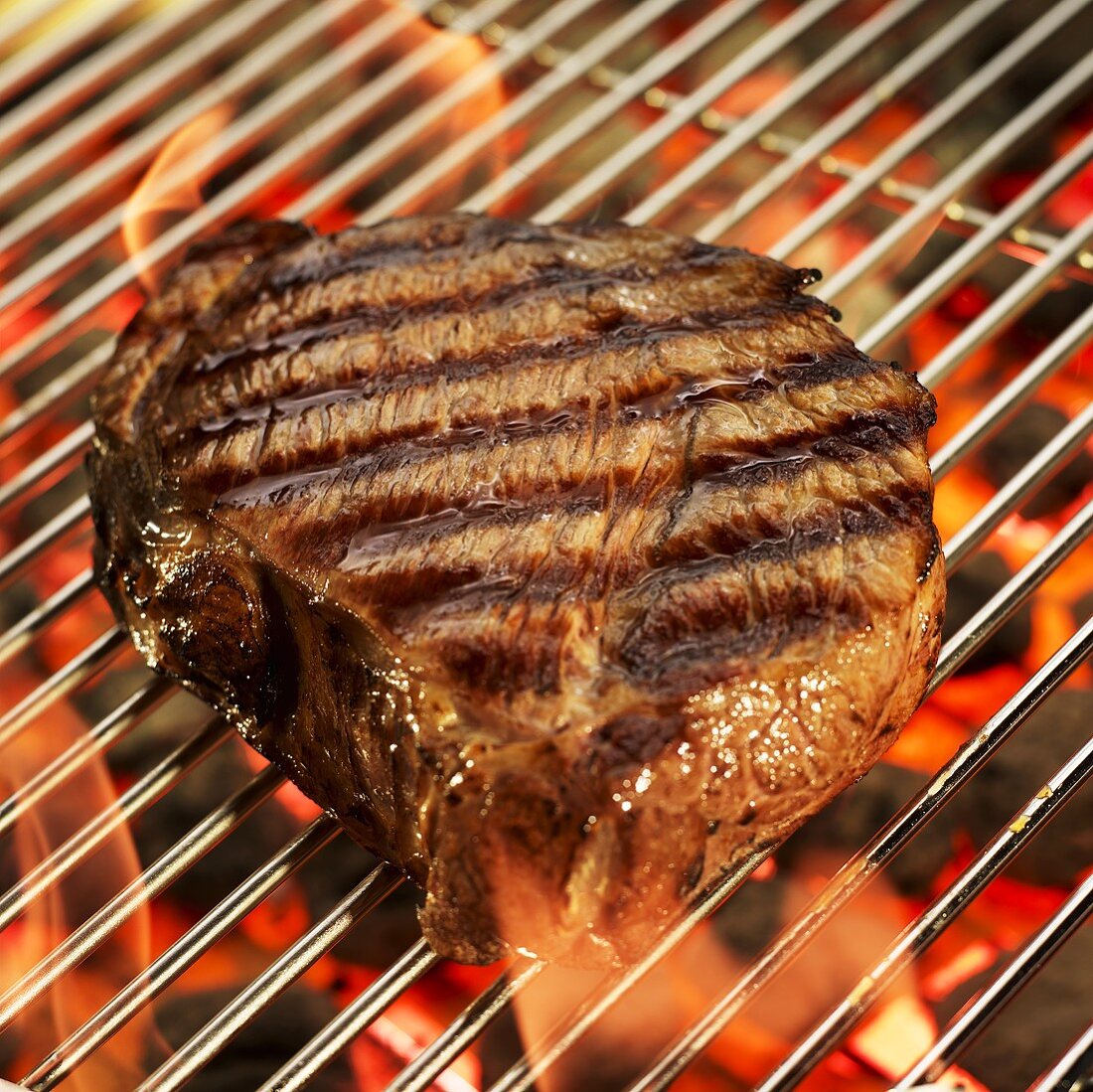 Sirloin Steak on a Grill; Flames