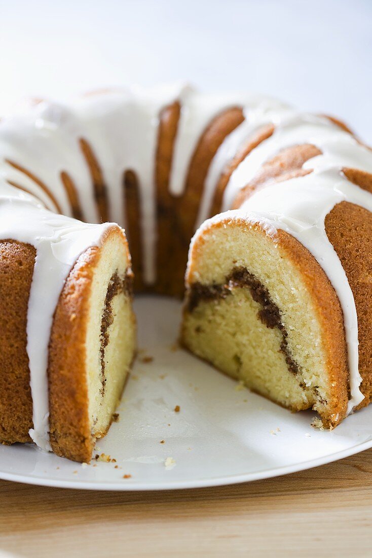 Cinnamon Bundt Coffee Cake with Icing; Slice Removed