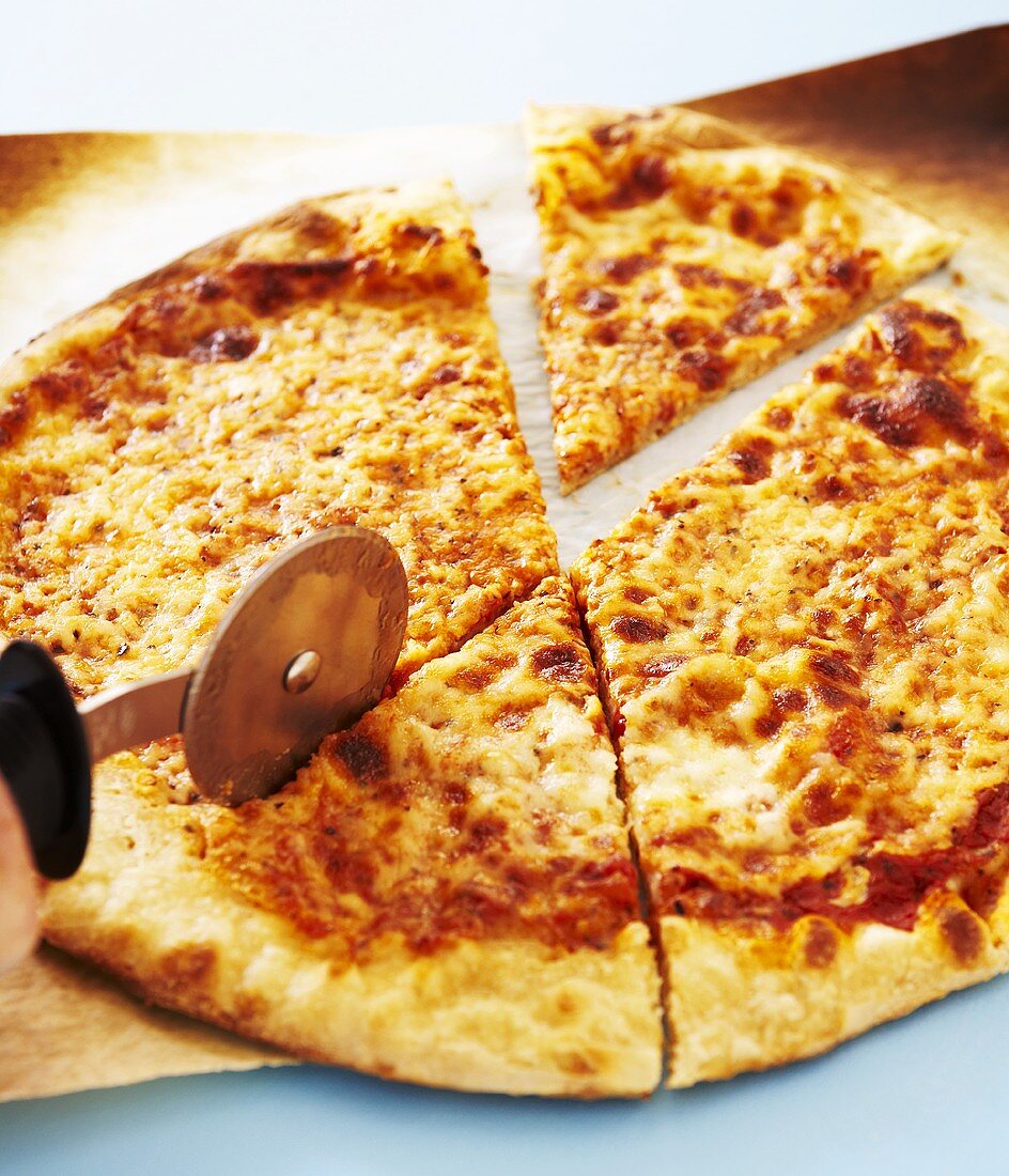Cheese Pizza Being Sliced