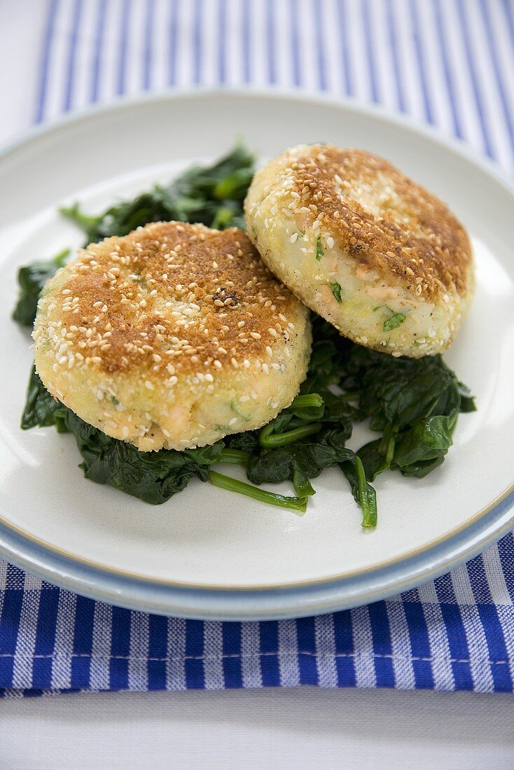 Sesame Salmon Fishcakes Over Wilted Spinach