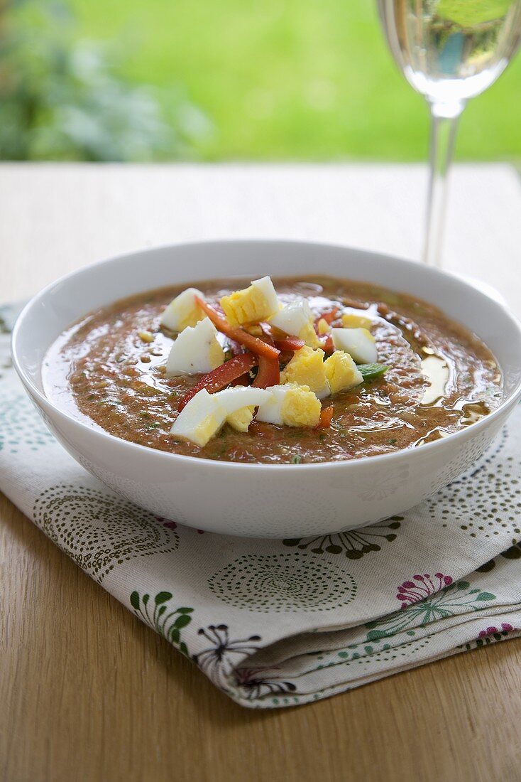 Bowl of Gazpacho Soup Topped with Boiled Egg